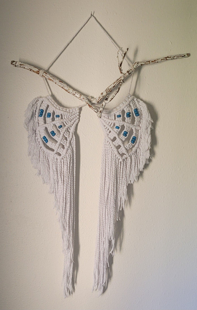 White angel wings with turquoise beads