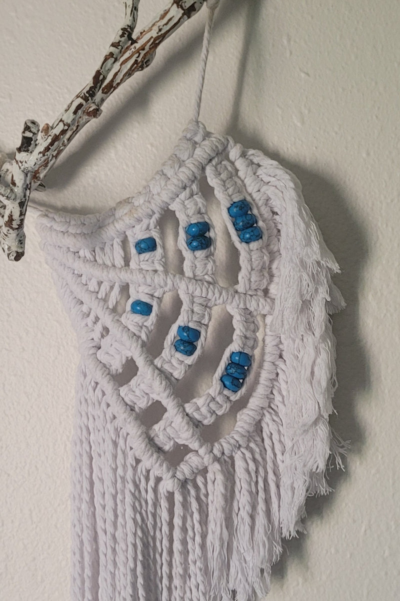 White angel wings with turquoise beads